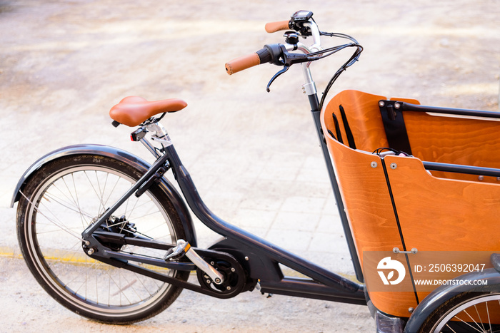 Detail of a bicycle with wooden cart to transport goods in a sustainable way.