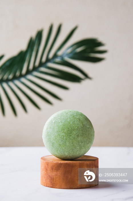 Handmade solid shampoo bar over marble. Zero waste.