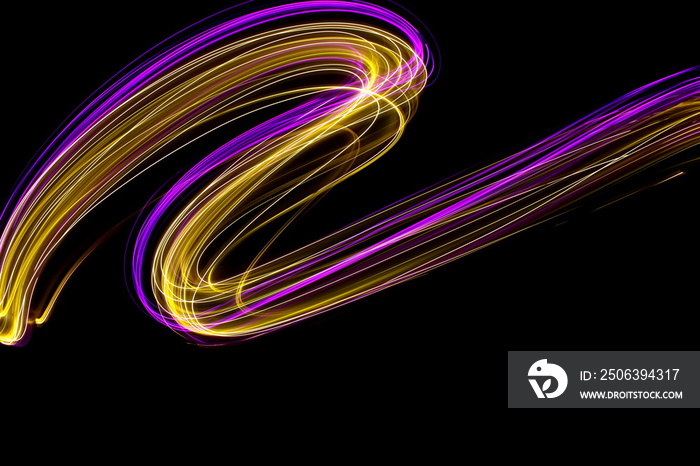 Long exposure light painting photography, curvy lines of vibrant neon pink and metallic yellow gold 