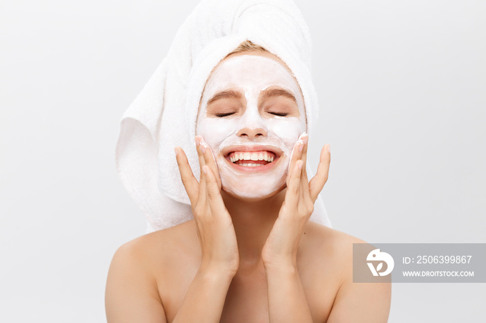 Beautiful woman with facial mask on white background