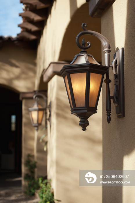 Close-up of lit lanterns on house wall; Scottsdale; USA