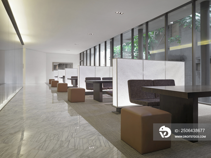 Ottomans in dining area of contemporary hotel