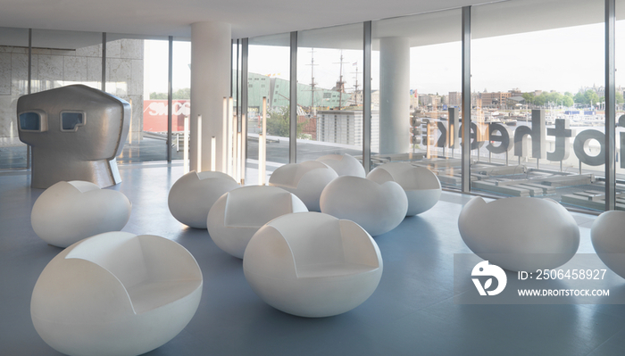 Modern rocking chairs and skull room in public library; Amsterdam; North Holland; Netherlands; Euro