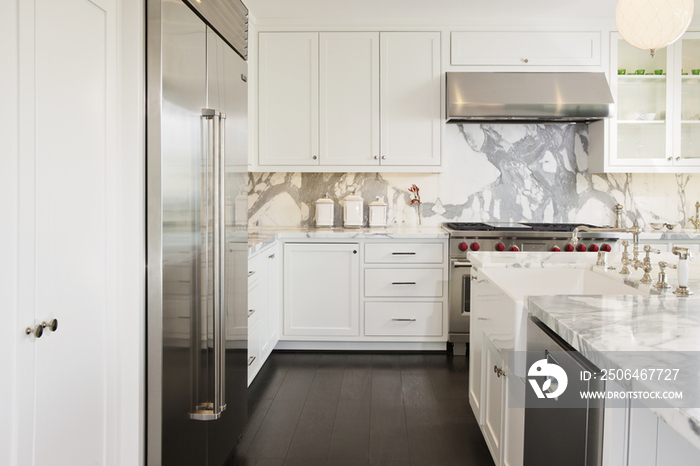 Refrigerator in modern white kitchen; California; United States of America