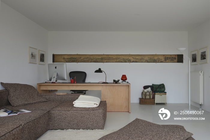 Couch with study area in the background at a modern home