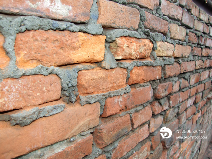 old brick wall with half distroyed brick