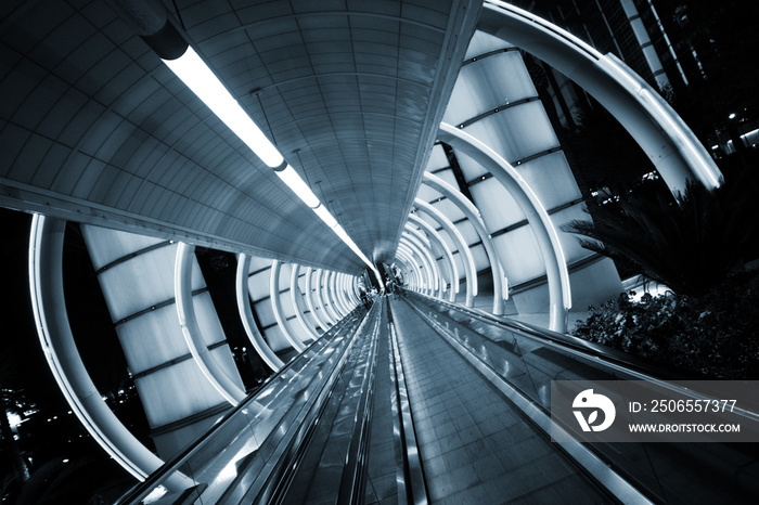 Futuristic architecture. Tunnel with moving sidewalk