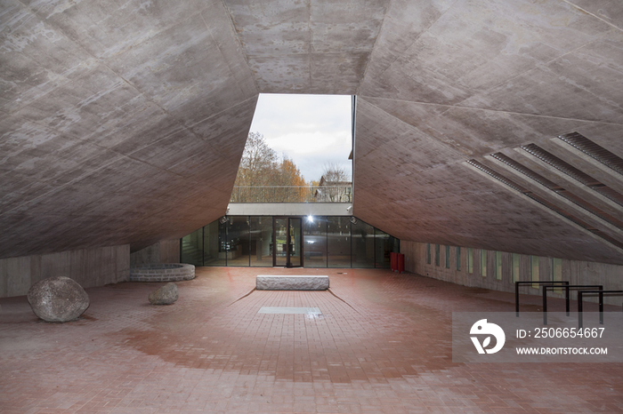 A large open space with a sloping overhang roof 