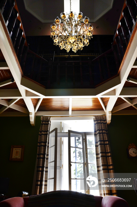 Low angle view of chandelier hanging in house