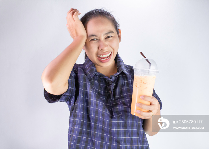 Asian young woman touching head with hand because she Brain freeze from drinking cold water. Health 