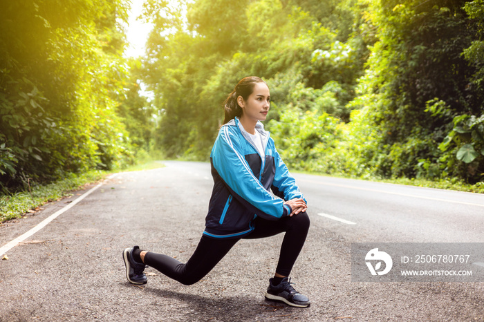 Asian women warm up by stretching in the morning.