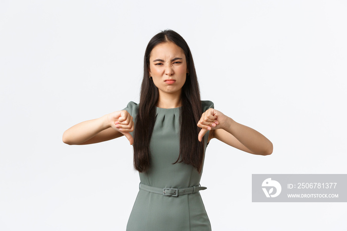 Small business owners, women entrepreneurs concept. Displeased grimacing asian woman dislike, expres