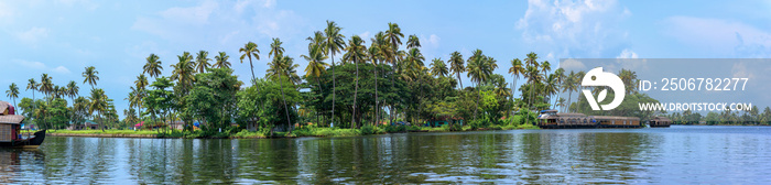 Panoramic river view and boat in Keralas Backwaters, India.