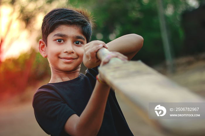 Rural Indian Child Playing Cricket