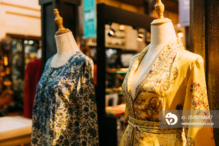 Mannequins dressed in beautiful female woman traditional oriental clothes In store of shopping cente