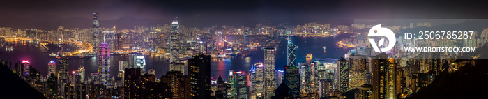 Night light panoramic cityscape of Central District and Kowloon, Hong Kong. Scenery aerial view from