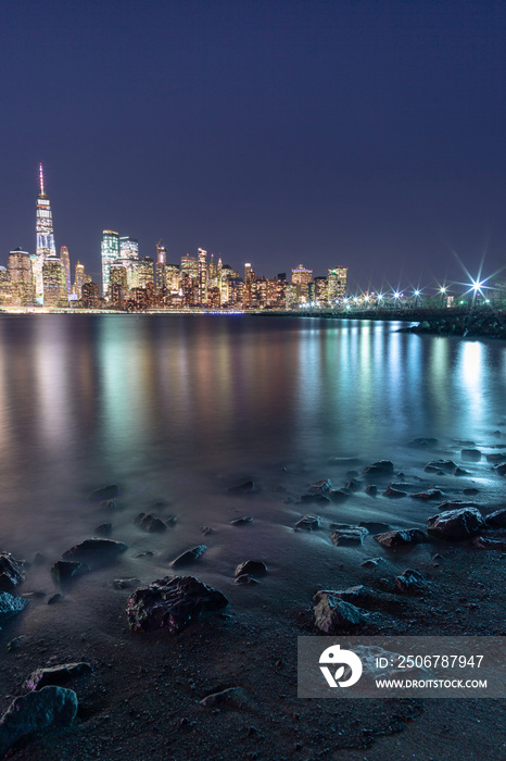 View on Financial district from the beach at night with long exposure 