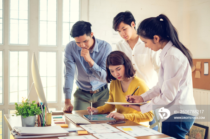 Group of young asian creative people. Mobile application designers and website designers brainstorm 