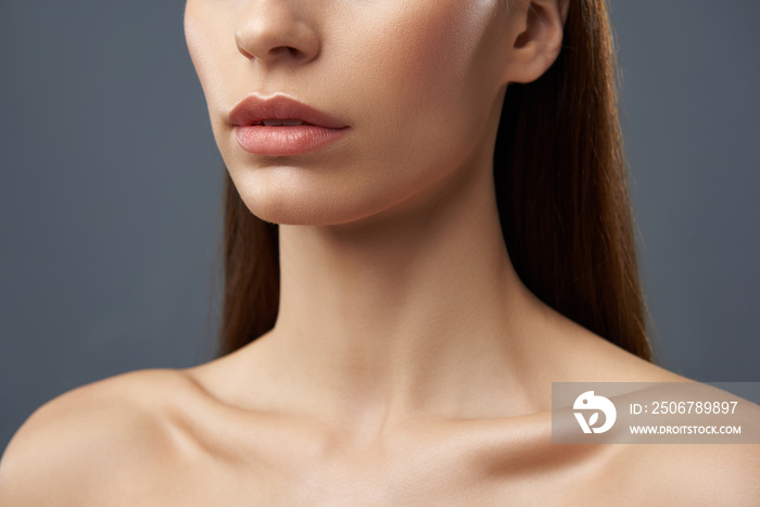 Young lady with beautiful full lips and graceful neck