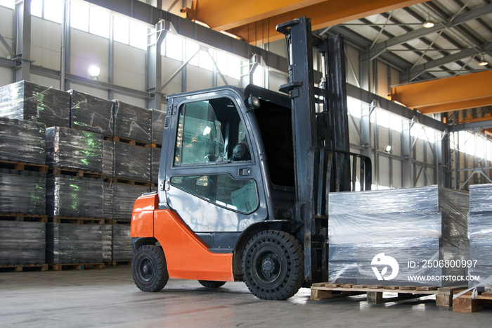 Working Forklift in warehouse. Forklift loader pallet stacker truck equipment at warehouse