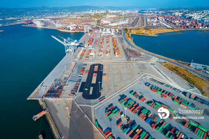 Oakland Harbor port terminal with shipping containers and cranes