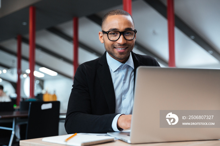 Young businessman working with laptop