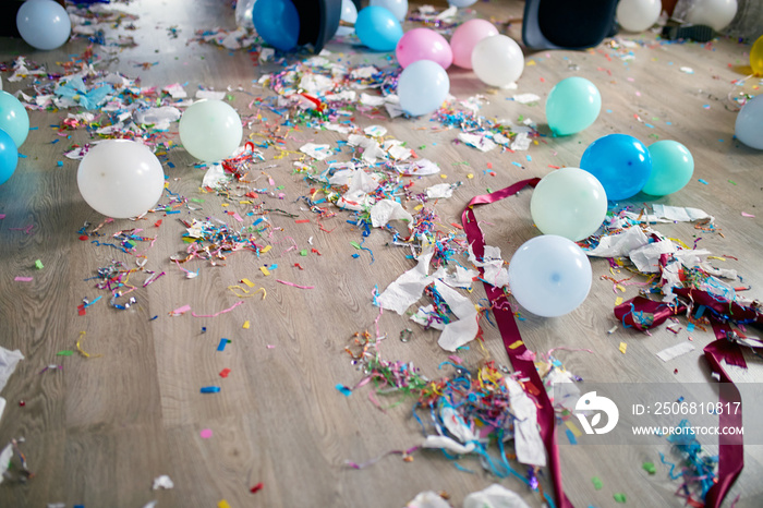 Top view of floor with after a party celebration with empty blue bottles