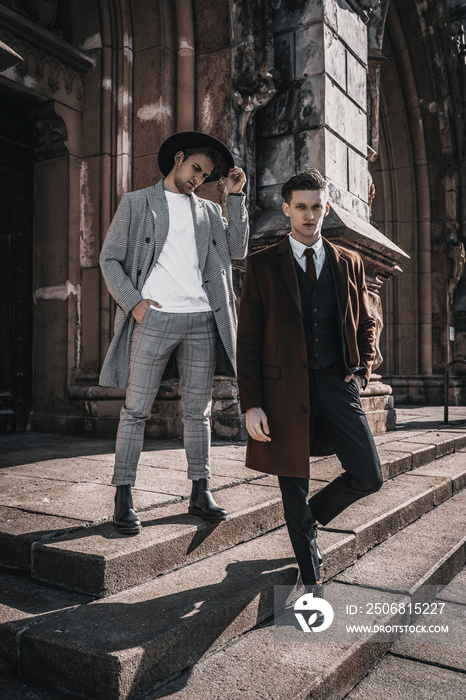 Two fashion men on urban background in stylish casual and classic clothes with trendy hairstyle. Han