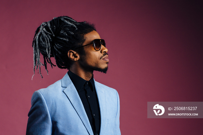 Portrait of a young man with cool hair in studio