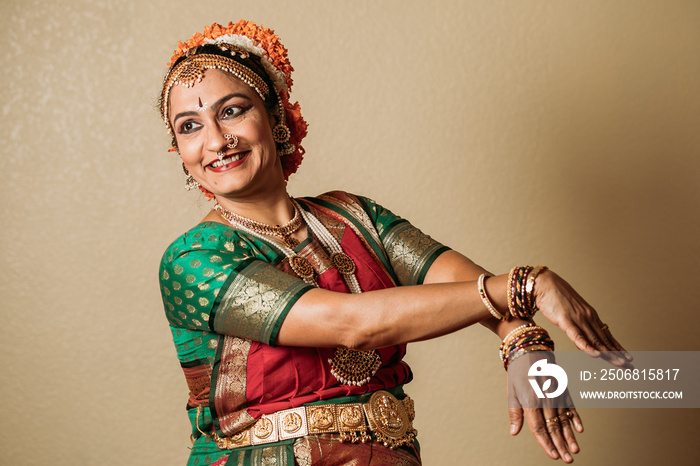 Kuchipudi dancer smiling with her hands in a pose