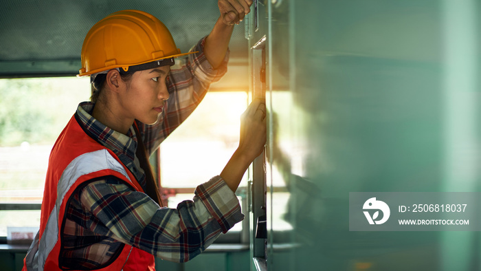 The industrial mechanical engineer technician is adjusting the systems of the machine.