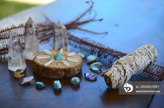 Bright, healing crystals and palo santo. Mystical, low exposure macro photo of crystals. Healing sto