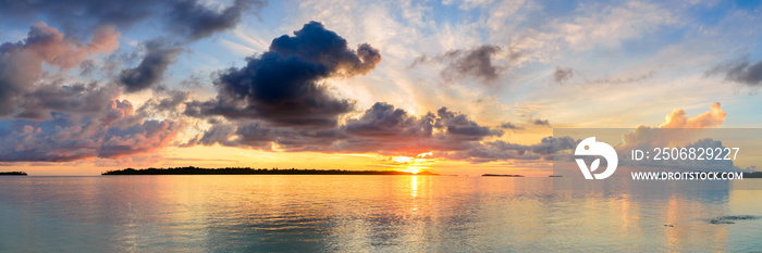 Sunrise dramatic sky on sea, tropical desert beach, no people, stormy clouds, travel destination, In