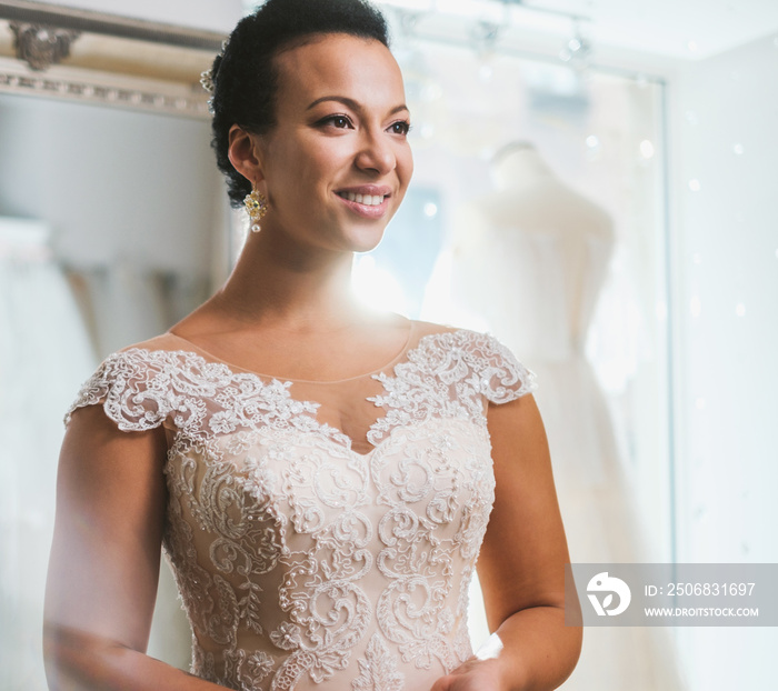 Beautifu bride choosing wedding dress in a wedding salon