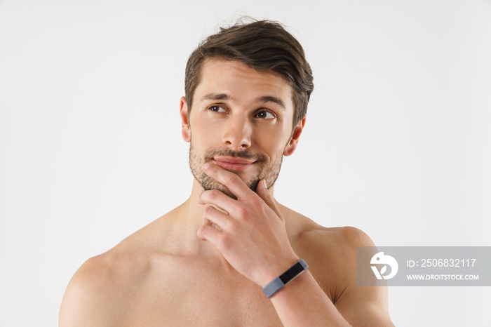 Close up of a handsome young shirtless man isolated