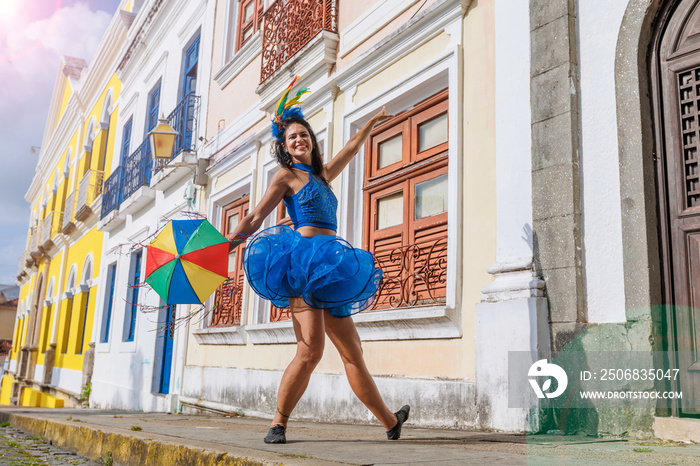 Beautiful Latin dancer dressed up for Carnival on the streets of Olinda. Frevo Recife. Brazil colors