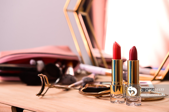 Professional lipsticks on wooden dressing table