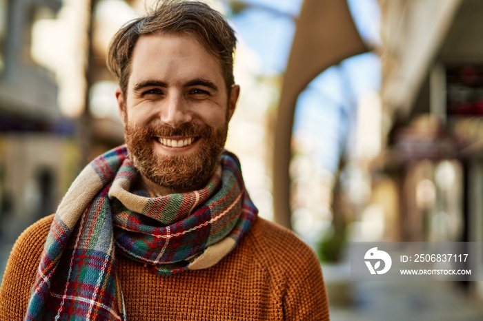 Young caucasian man with beard outdoors on a sunny day