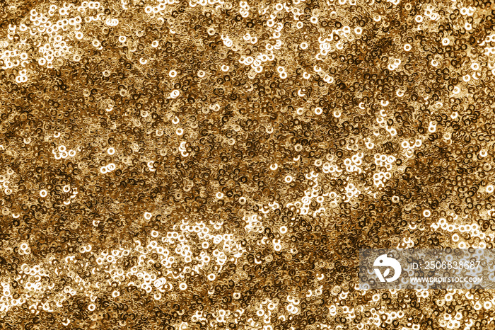 Sparkling gold sequins textile background.