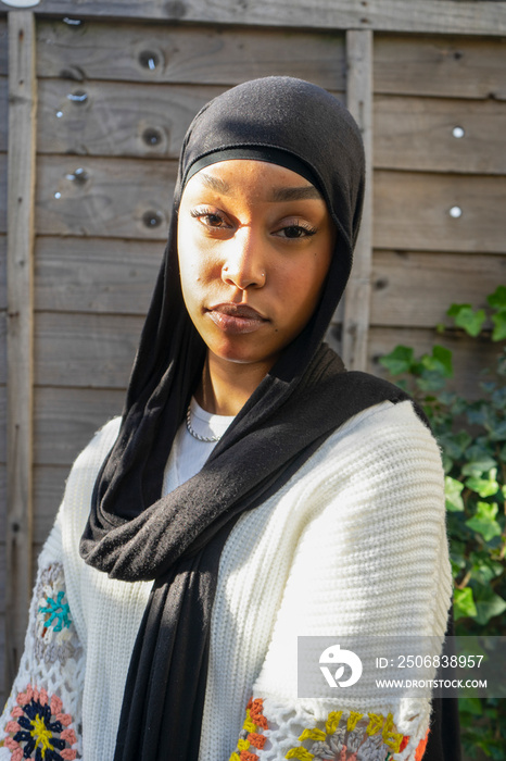 Portrait of woman wearing hijab outdoors