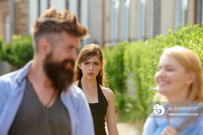 Totally jealous of him. Bearded man cheating his girlfriend with another woman. Jealous woman look a