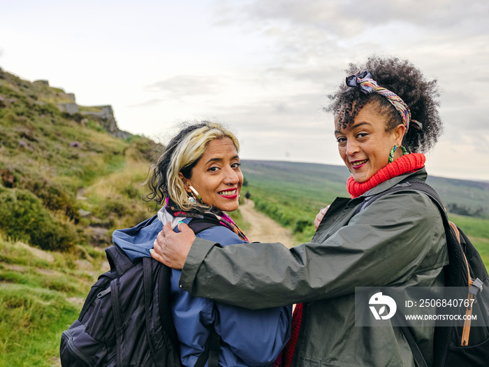 Portrait of female couple hiking in countryside