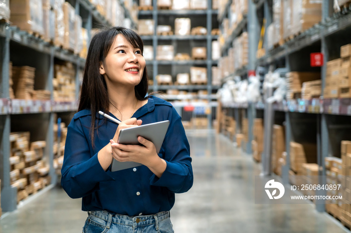 Young asian woman auditor or trainee staff work looking up and checks the number of items store by d