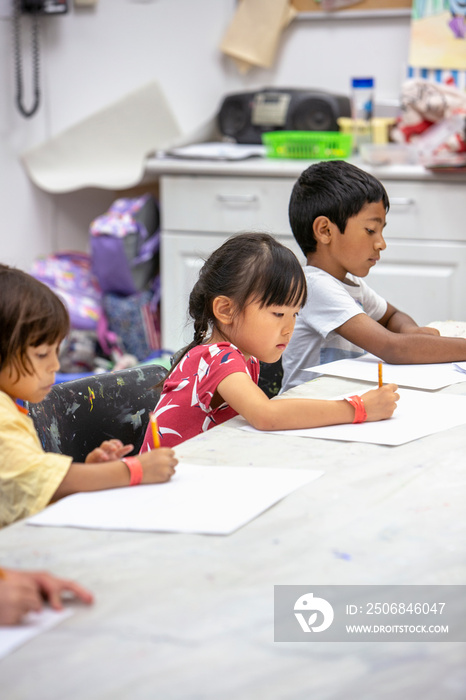 Young children drawing