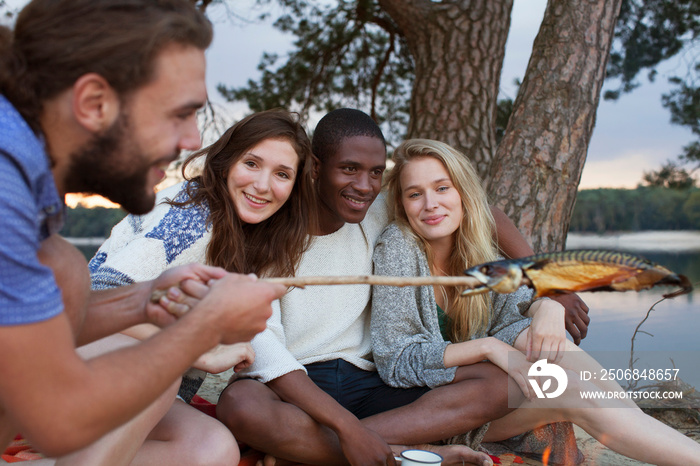 Couples camping by lake