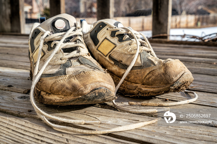 old muddy running shoes