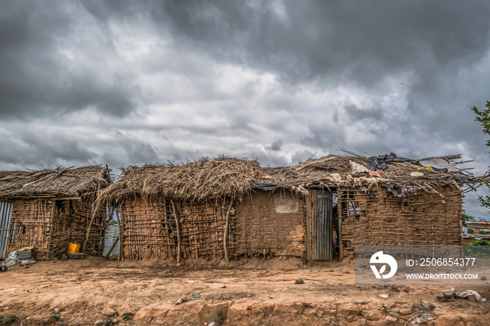 View of traditional village, house thatched with roof and terracotta walls in Angola