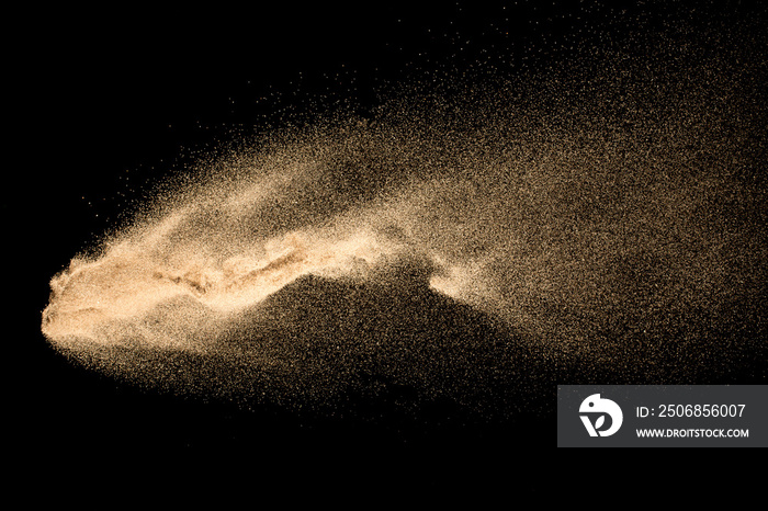 Dry river sand explosion isolated on black background. Abstract sand cloud.Brown colored sand splash