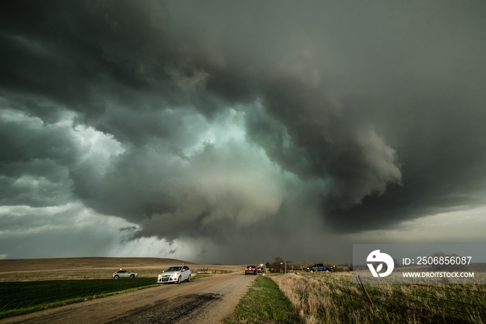 Monster supercell with developing wall cloud moves across central Kansas and later forms a destructi