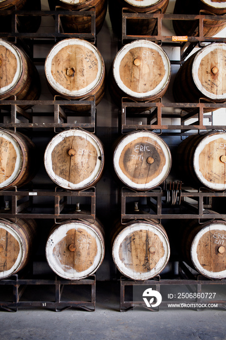 Beer barrels on rack in beerhouse